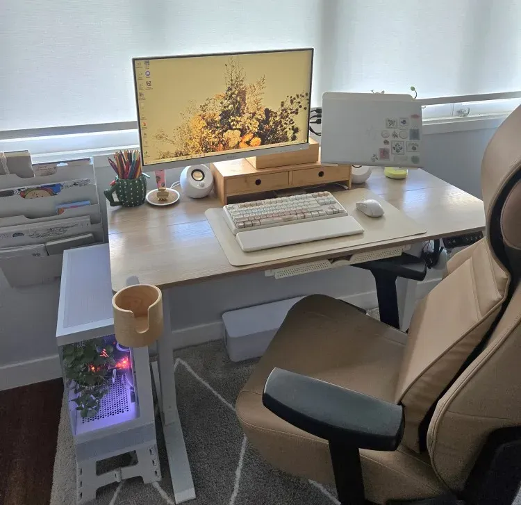 Light-colored PU leather desk mat on a buyer's desk setup