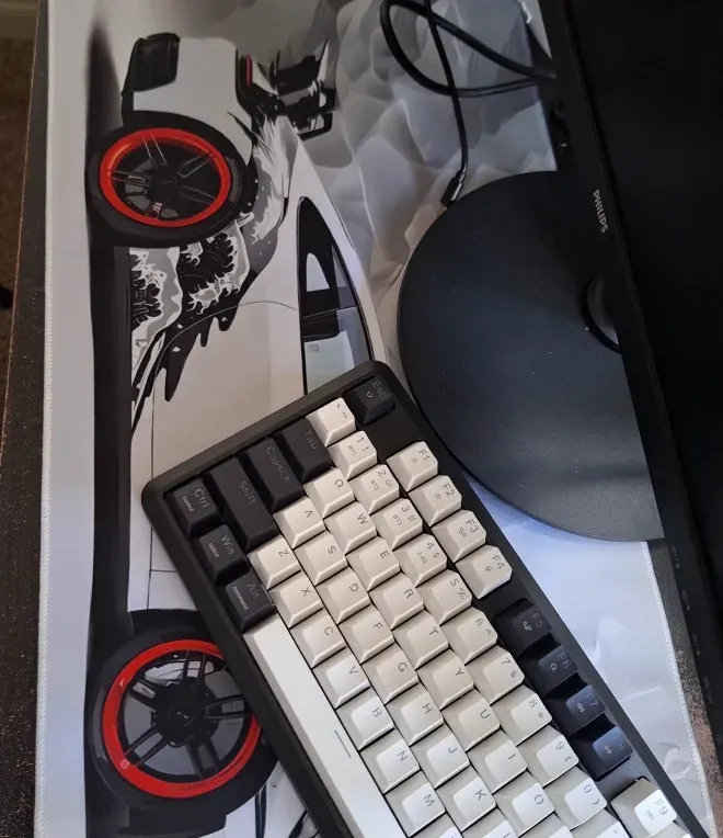 Sports car desk mat with keyboard and mouse in place, buyer photo